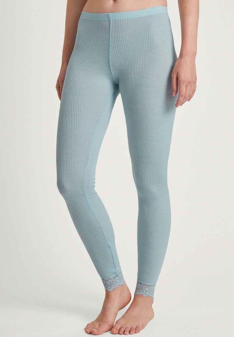 Lichtblauwe geribbelde leggings met een aansluitend ontwerp en kanten accenten bij de enkelranden. Gemaakt van zacht, rekbaar materiaal voor comfort.