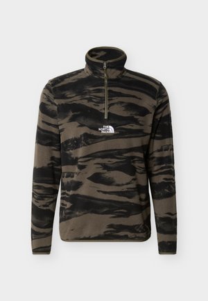 Brun og svart tigerstripet fleecegenser med kvartglidelås og "The North Face"-logo på brystet.