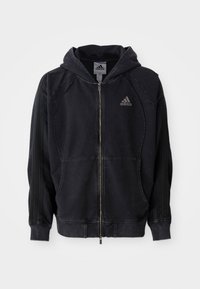 Black Adidas zip-up hoodie with hood, front pockets, three stripes on sleeves, and Adidas logo on left chest.