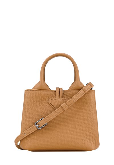 Tan leather handbag with a textured finish, two short handles, and a detachable shoulder strap. Features a central flap detail.