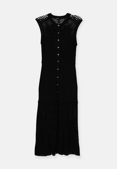 Knit black dress featuring a scoop neck, short sleeves, button front, and lace-like detailing throughout, with a flared hemline.