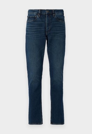 Vaqueros de denim azul oscuro con corte recto, cinco bolsillos, trabillas para cinturón y detalles de desvanecimiento sutil. Costuras cosidas y cierre de botón.