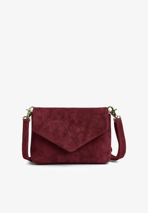 Burgundy suede crossbody bag with a flap closure, gold hardware, and adjustable strap. Textured surface with a smooth finish.