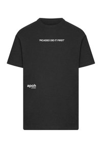 Black cotton t-shirt featuring white text that reads "PICASSO DID IT FIRST" on the front and "apoh London" on the lower side.