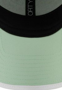 Black mesh cap with a mint-green visor, featuring a textured fabric, slightly curved shape, and a white underside. Accented with black labeling.