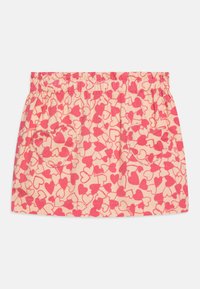 Rosa hjerte-mønstret skjørt laget av myk stoff. Har elastisk liv og to hjerteformede lommer. Lett og uformell design.