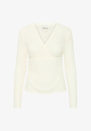 Biela čipkovaná blúzka s výstrihom do V a dlhými rukávmi. Má prekrytý dizajn a textúrovaný kvetinový vzor. Jemný lem pozdĺž spodného okraja a manžiet.