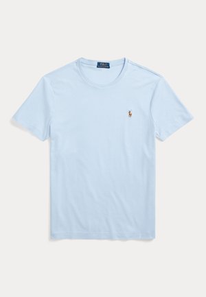T-shirt in cotone azzurro chiaro con scollo rotondo e maniche corte. Presenta un piccolo logo ricamato sulla parte sinistra del petto. Texture liscia.