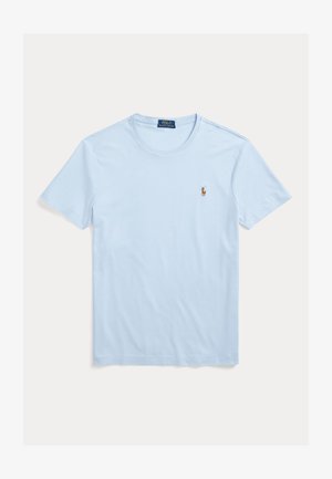 T-shirt in cotone azzurro chiaro con scollo rotondo e maniche corte. Presenta un piccolo logo ricamato sulla parte sinistra del petto. Texture liscia.