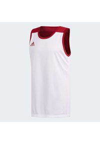 Maillot de sport sans manches en tissu blanc avec des accents rouges vifs sur les épaules et le col ; arbore le logo Adidas en rouge sur le devant.