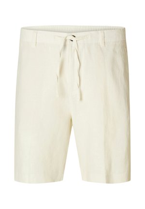 Linskjorts i en lys kremfarge, med snøring i midjen og en avslappet passform, laget av en glatt, strukturert stoff.