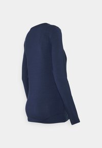 Camisola de manga longa azul-marinho feita de um tecido suave, com forma ajustada, decote redondo e rachas laterais para maior conforto.