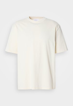Ein einfarbiges, off-white T-Shirt mit kurzen Ärmeln und Rundhalsausschnitt, unisex Design, auf einem neutralen grauen Hintergrund präsentiert.