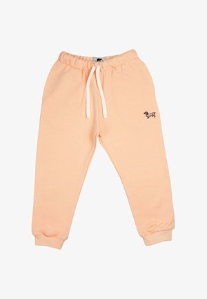 Licht perzikkleurige joggingbroek van zachte stof, met een elastische tailleband en een trekkoord, en boorden bij de enkels. Kleine hondenborduring.