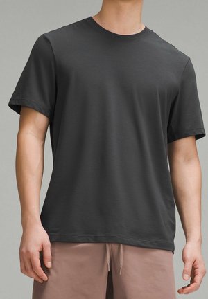 Dark gray cotton t-shirt featuring a crew neck and short sleeves, with a smooth texture and a relaxed fit.
