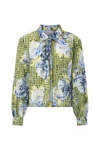 Floral blouse featuring a green background with blue and yellow floral patterns, long sleeves, and a button-up collar. Wrinkled texture.