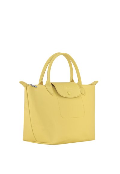 Yellow soft leather handbag with two rounded handles, a flap with snap button closure, and a top zipper pocket.