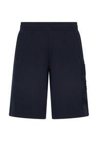 Pantaloni sportivi navy realizzati in tessuto liscio, con vita elasticizzata, tasche laterali e un dettaglio del logo testurizzato sulla gamba sinistra.