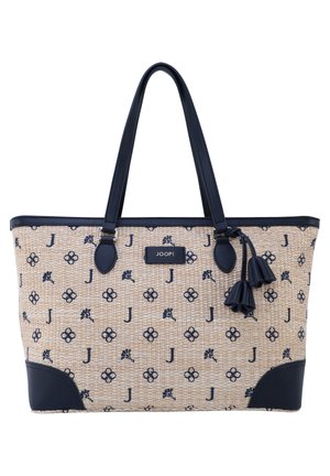 Beige geweven tote tas met marineblauw bloemmotief en 'J' patroon, marineblauwe handvatten, hoekversterkingen, kwastaccenten en centrale JOOP! logopatch.
