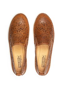Brown leather slip-on shoes with floral cut-out pattern, tan interior, padded insole, and white rubber outsole. Reinforced stitching along edges.
