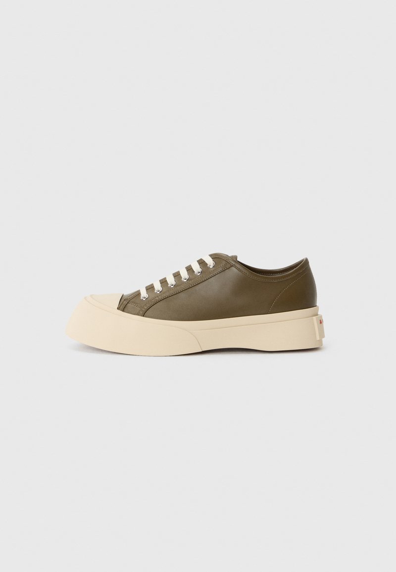 Olive green low-top sneaker with a thick cream sole and white laces, displayed on a plain white background.