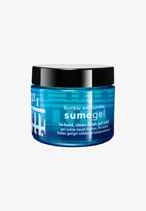 Bumble and Bumble Sumogel i en transparent blå krukke med et sort låg. Indeholder hvid tekst med produktnavn og beskrivelse.