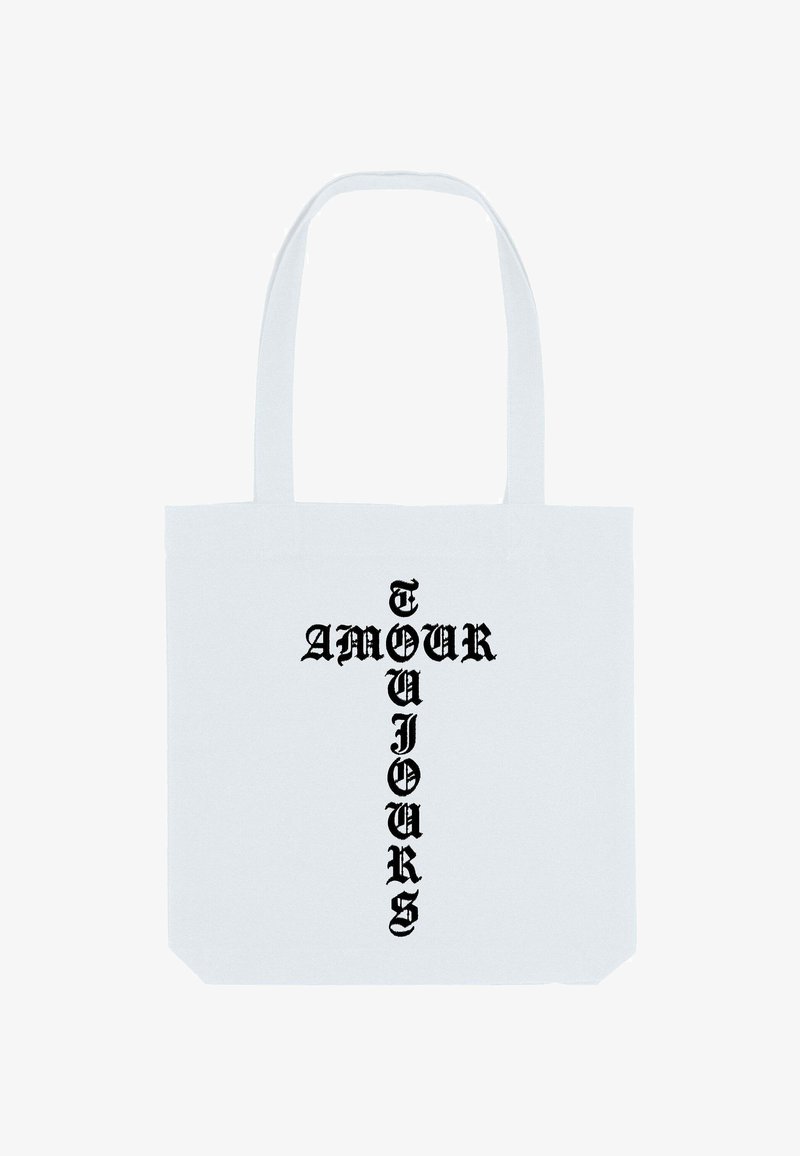Sac tote en toile blanche avec un texte noir audacieux indiquant "AMOUR TOUJOURS" disposé en motif croisé vertical. Tissu durable, longues anses.