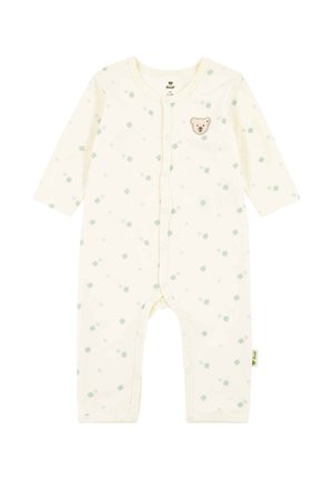 Baby-Strampler in Cremefarbe mit langen Ärmeln, grünem Kleeblattmuster, Druckknöpfen vorn und einem kleinen Teddygesicht-Patch auf der Brust.