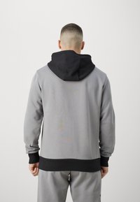 Puma POSTERIZE 2.0 - Sweat à capuche - stormy slate/black
