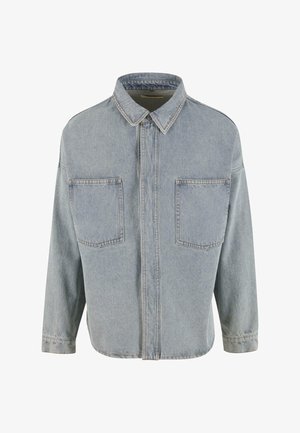 Heledad sinine teksajakk nööpideiga esiosal, kaelusega ja kahe rinna taskuga. Omab pikki varrukaid ja lõdva lõikega disaini.