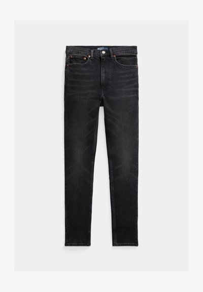 Zwarte slim-fit jeans met vijf zakken, knoopsluiting en Polo merklabel op de tailleband, plat op een witte achtergrond gelegd.