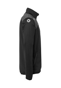 Heren zwart softshell jack met een grijs schouderpaneel, hoge kraag, zijzak met rits en een logo op de linker schouder. Glad textuur.