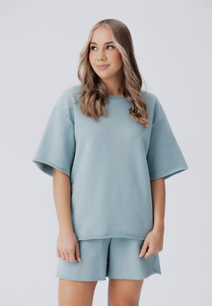 Laurella NAOMA SET - Donji dijelovi trenirke - light blue