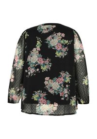 Blouse noire transparente à manches longues avec motifs floraux multicolores et texture subtile à pois sur les manches et l'ourlet.