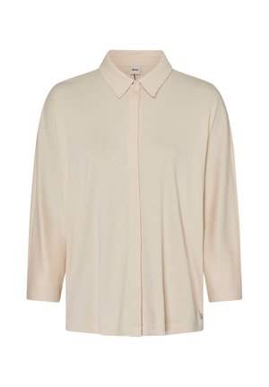 Beige langärmliges Hemd mit Knopfleiste und spitzem Kragen, präsentiert auf einem schlichten weißen Hintergrund.