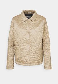 Quilted jacket in light gold, featuring a collared neckline, long sleeves, and diagonal diamond pattern. Smooth, shiny outer material.
