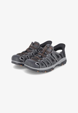 Black water shoes with mesh panels, orange accents, a rubber toe cap, and elastic laces. Designed for comfort and breathability.