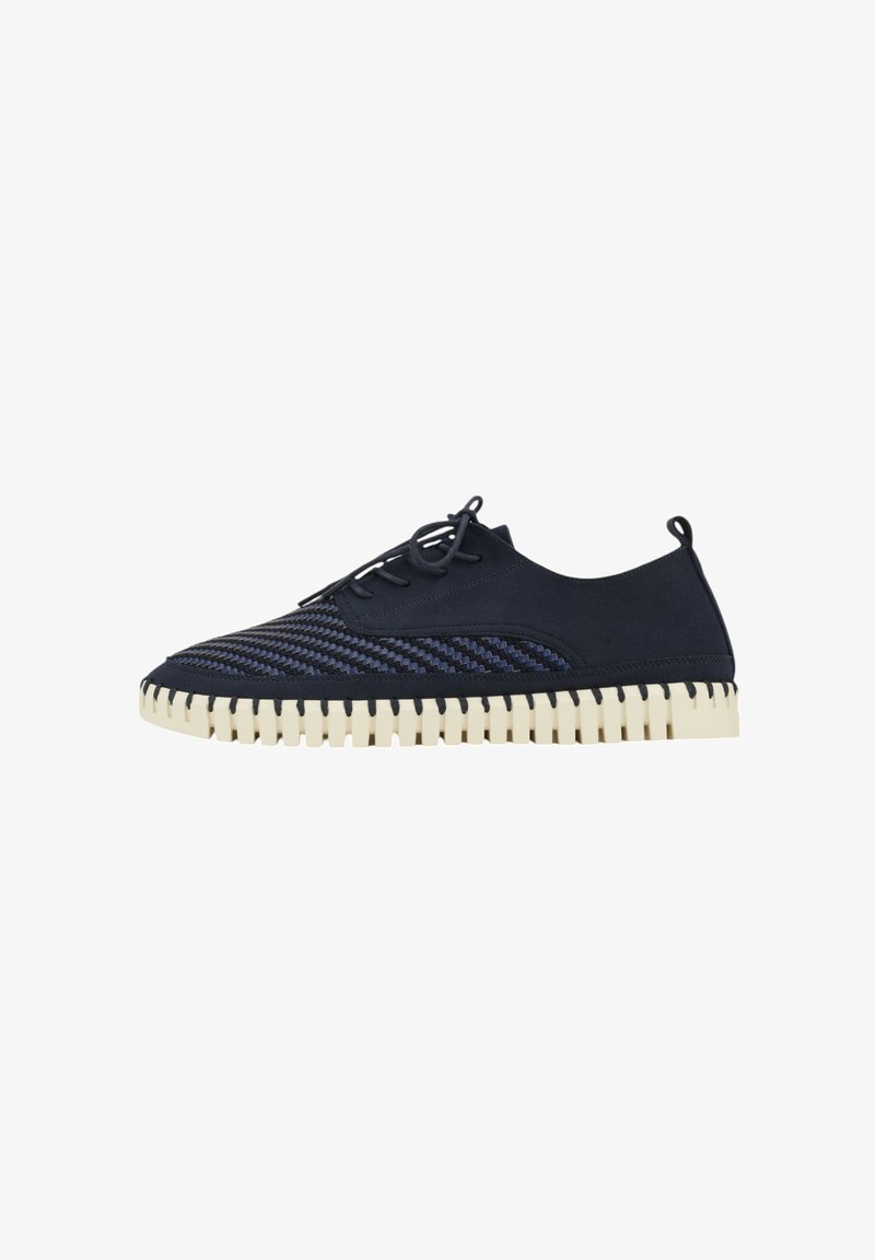 Navy blue suede shoe with textured stripes, round toe, and cream-colored rubber sole featuring exposed stitching and a lace-up design.
