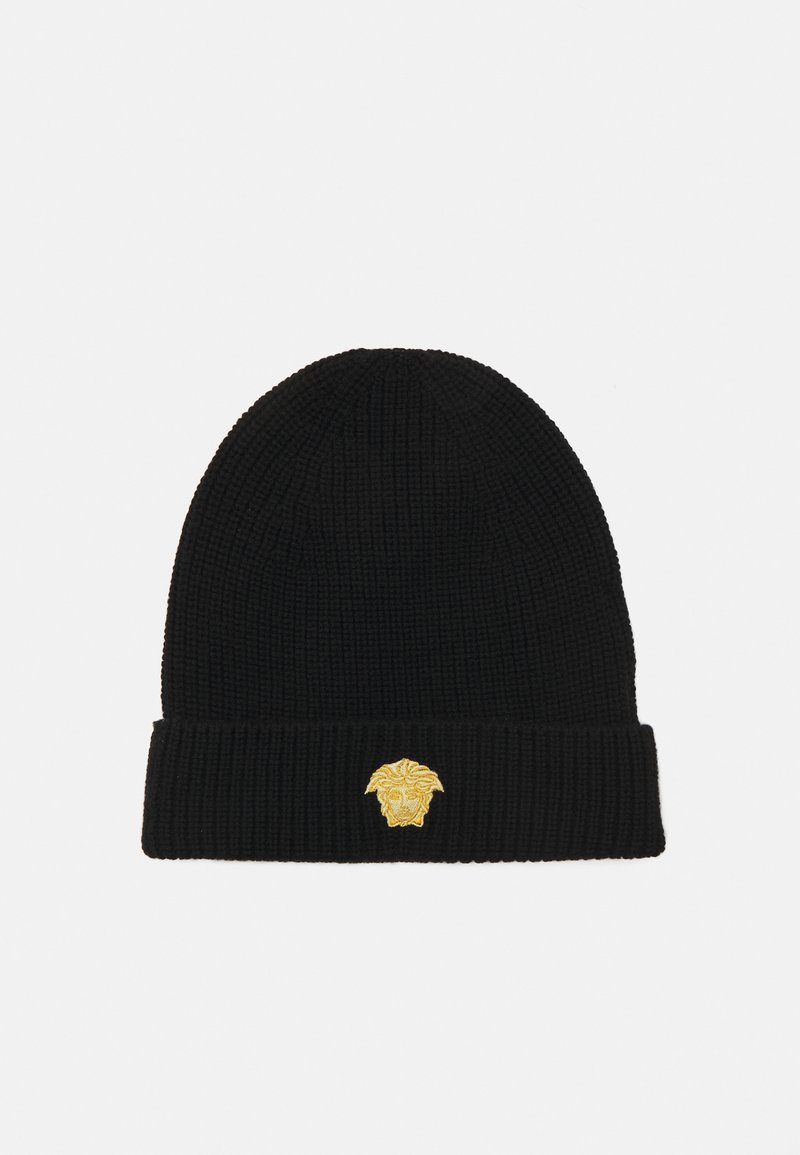 Gorro de punto negro con textura acanalada y un puño doblado, que presenta un diseño de león bordado en dorado en la parte frontal.