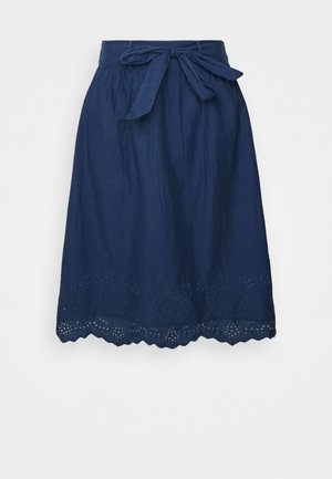 Marineblå nederdel med bindebånd i taljen, med broderie anglaise-detaljer langs kanten og en afslappet silhuet. Fremstillet i letvægtsstof.