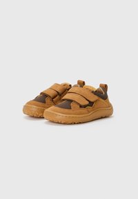 Brown mesh and suede children's shoes with double Velcro straps, rounded toe, textured rubber sole, and pull tab at the heel.