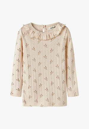 Maglietta per bambini a maniche lunghe color crema con piccolo motivo floreale marrone, righe verticali testurizzate e collo arricciato con chiusura a bottone sul retro.