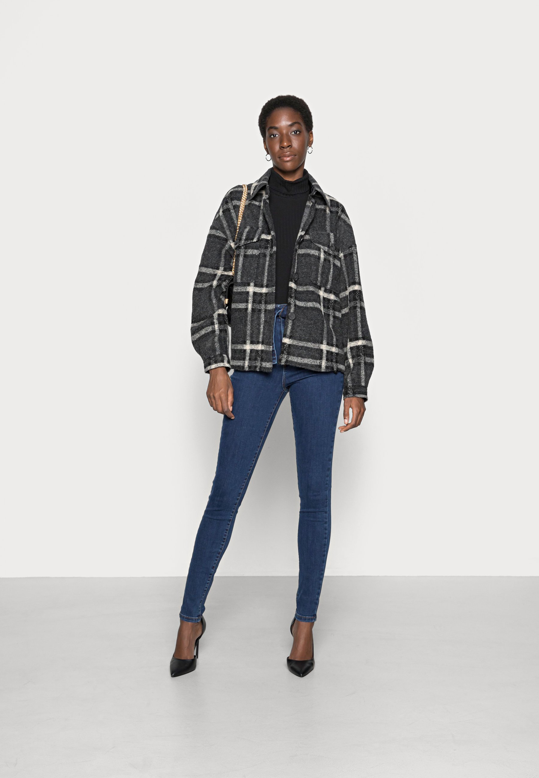 dark shirt light jacket