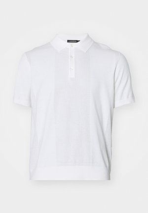 White short-sleeve polo shirt made of textured knit fabric, featuring a collared neckline, button placket, and panel detailing.