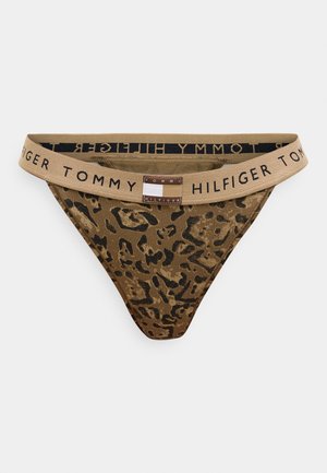 Brun och svart leopardmönstrad trosa med beige elastiskt midjeband med texten "Tommy Hilfiger" och en liten rektangulär logotyplapp fram i mitten.