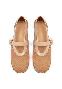 Beige mesh shoes featuring a patent leather strap with a button closure. Rounded toe design with a textured, breathable upper.