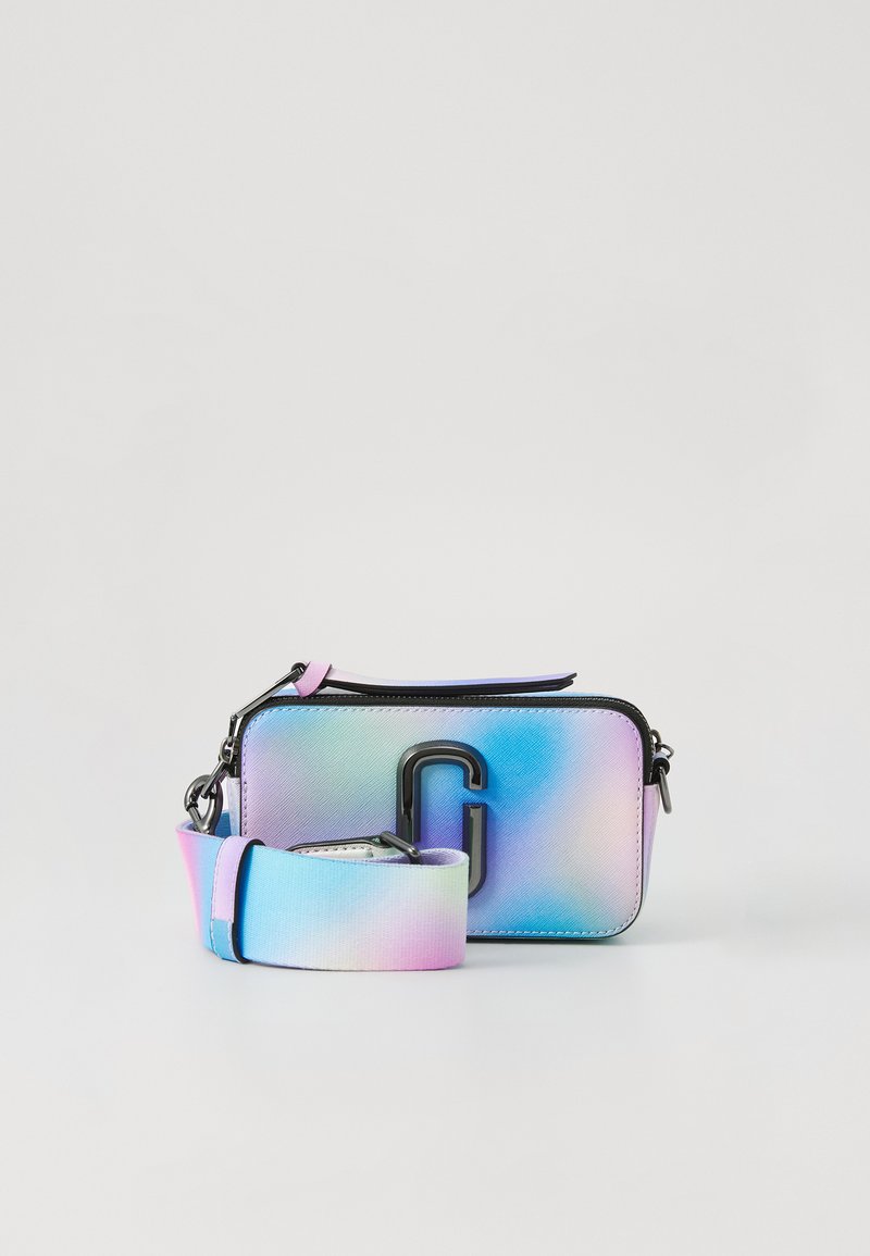 Small rectangular crossbody bag with pastel rainbow gradient, black metal logo, and wide detachable strap in matching colors.