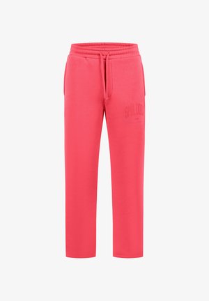Coral pink sweatpants with elastic waistband, drawstring, side pockets, and subtle text logo on left thigh.