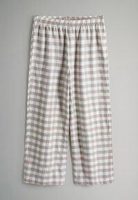 Vieglie, puszābaku garuma bikses, kas izgatavotas no beige un baltā rūtainā auduma. Tām ir elastīga josta ērtībai. Gluda, mīksta tekstūra.