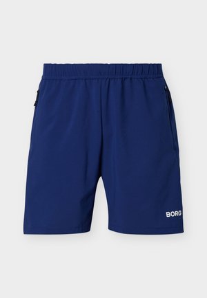 Tmavě modré sportovní kraťasy s elastickým pasem, kapsami na zip po stranách a bílým logem "BORG" na dolní části levé nohy.